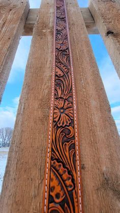 an old wooden structure with carvings on it