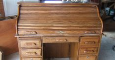 an old wooden desk with lots of drawers