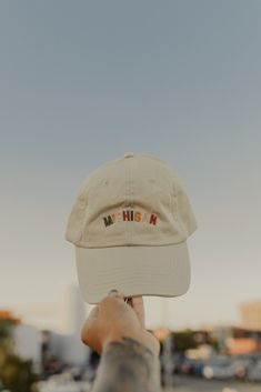 Your go-to summer hat is here. A new take on our best selling Michigan ball cap. Throw it on with a t-shirt dress and sneakers for a laid back look. Tan ball cap Multi color embroidery Unisex, adjustable back, one size fits most Hats For Pictures, Adjustable Fitted Hat For Summer, Affordable Summer Festival Baseball Cap, Cheap Fun Style Baseball Cap For Outdoor, Casual Cheap Cap Style Hats, Fun Baseball Cap For Outdoor, Casual Cap Style Hat, Cheap Fall Cap Hats, Trendy Hats 2022