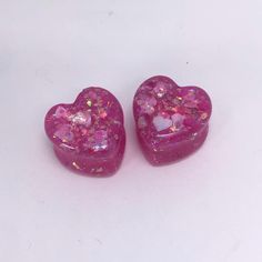 Cute pink heart shaped resin plugs with holographic and heart glitter. Available in 18mm, 16mm, & 14mm. Pink Heart Resin Earrings, Pink Resin Heart Earrings, 14mm Gauges, Cute Gauges, Cute Pink Heart, Heart Glitter, Plug Earrings, Gauged Earrings, Plugs Earrings