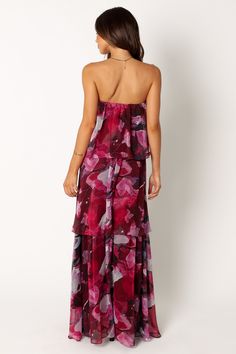 DETAILS   This maxi dress is perfect for any formal or special event! With its strapless style, elasticised straight neckline and drop-tiered ruffle design, this maxi dress will make you feel both elegant and feminine. The vibrant purple floral leaf print adds an extra touch of fun to the look.    maxi length  strapless style    elasticised straight neckline  drop tiered ruffle design  purple floral leaf print  pull on design  lined   material - 100% polyester    SIZING    model is 5' 6" and wea Strapless Ruffled Maxi Dress For Gala, Summer Bandeau Maxi Dress For Prom, Bandeau Maxi Dress For Summer Prom, Chic Strapless Maxi Dress With Ruffles, Tiered Strapless Dress For Summer Evenings, Strapless Tiered Dress For Summer Evenings, Tiered Strapless Evening Dress For Summer, Summer Prom Maxi Dress With Tiered Skirt, Summer Strapless Maxi Dress For Gala