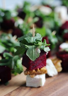 beet and goat cheese appetizer with greens on top