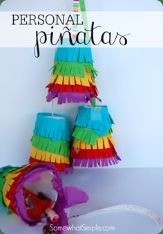 colorful paper pinatas are arranged on a white background with text overlay that reads, personal pinatas