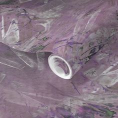 an abstract painting with white and purple colors on the wall, it looks like something from outer space