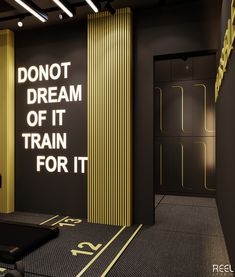 a room with black walls and yellow lines on the wall that says, don't dream off it train for it