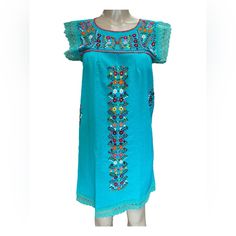 The Beautiful Tehuacn Dress Just Got Even Cuter With Lace Accents! Made In Cotton Manta Fabric With Silk Thread Embroidery. Available In Size Small, Medium, Large And X-Large. Please Consider That The Colors And Patterns Of The Embroidery Are Always Different Than The Ones In The Pictures. Casual Blue Embroidered Dress For Vacation, Blue Embroidered Midi Dress, Fitted Casual Blue Embroidered Dress, Blue Bohemian Embroidered Midi Dress, Turquoise Bohemian Short Sleeve Dress, Casual Blue Embroidered Midi Dress, Fitted Blue Embroidered Dress With Short Sleeves, Fitted Blue Embroidered Casual Dress, Blue Bohemian Knee-length Dress