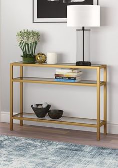 a living room scene with focus on the console table and vases sitting on it