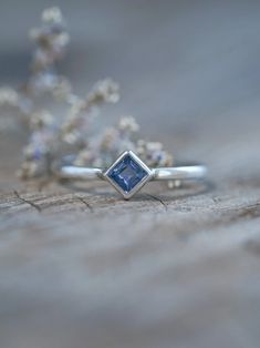 Simple, but not quite ordinary. Subtle, but not quite average. Here's a square sapphire ring to harness clear thoughts and focus in your day-to-day life. Each piece of our jewelry is handcrafted with love. Rectangular Sapphire Promise Ring In Sterling Silver, Square Cut Sapphire Ring For Gift, Square Cut Sapphire Ring As Gift, Square Cut Sapphire Promise Ring, Sterling Silver Square Cut Sapphire Promise Ring, Sapphire Princess Cut Ring For Gifts, Rectangular Sapphire Ring In Sterling Silver, Square Cut Sapphire Ring In Sterling Silver For Promise, Square Cut Sapphire Promise Ring In Sterling Silver