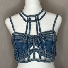 Club Exx This Super-Sexy Stretchy Denim Cropped Bustier Top Has Strappy Caged Cutouts All Over, Adjustable Shoulder Straps, And A Back Zip Closure. Materials: 70% Cotton 26% Polyester 2% Viscose 2% Spandex Care: Hand Wash Cold Fitted Denim Top For Summer Nights, Stretch Denim Top For Summer Night Out, Stretch Denim Top For Night Out In Summer, Cropped Dark Wash Stretch Tops, Dark Wash Stretch Cropped Tops, Dark Wash Cropped Stretch Tops, Fitted Denim Blue Crop Top, Stretch Cropped Top In Denim Blue, Fitted Cropped Blue Denim Top