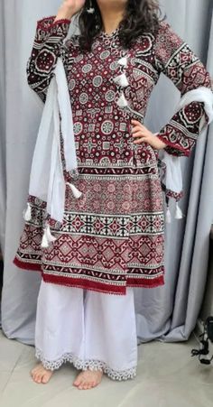 beautifully stitched PAKISTANI DRESS, Ajrak kameez peplum style and scarf this indian dress is for any occassion it is readymade and available in all sizes SMALL- CHEST 36 INCHES MEDIUM - CHEST40 INCHES LARGE - CHEST 44 INCHES XTRA LARGE- CHEST 48 INCHES  also available in kids sizes https://www.etsy.com/uk/listing/1165758638/kids-afghani-dress-girls-afghan-dress?ref=listings_manager_grid material: Cotton  all my dresses are high quality and are made with special care we are proud to be in the b Bohemian Sharara With Printed Motifs For Eid, Traditional Tunic Sets With Dupatta, Unstitched Red Bohemian Sharara, Unstitched Mulmul Bohemian Sharara, Cambric Dresses With Dabka For Festivals, Festival Cambric Dresses With Dabka Detail, Traditional Drape Mulmul Dress With Dabka, Traditional Drape Eid Dress Made Of Mulmul, Festival Mulmul Dresses With Dabka Details