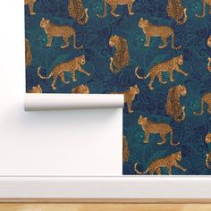 a wallpaper with gold leopards on green background and white trim around the edges