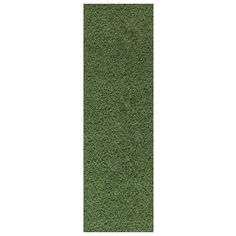 an area rug with green grass on the bottom, and white ground in the middle