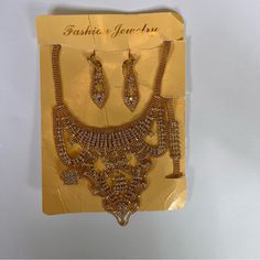 Cubic Zirconia Gold Tone Finish Women Jewelry Set Includes Necklace, Earring, Bracelet And Ring. Necklace Has Links To Adjust Size. Nwot Necklace 10” - 18” Bracelet 8 1/2” Earring 2 1/4” Long X 5/8” Wide Ring Adjustable Size Gold Crystal Jewelry Sets With Jeweled Details, Gold Jewelry Sets With Diamond Accents And Crystal, Elegant Gold Jewelry Sets With Rhinestones, Gold Metal Jewelry Sets With Bling, Gold Rhinestone Jewelry Sets For Party, Gold Jewelry Sets With Sparkling Stones, Gold Crystal Jewelry Sets With Rhinestones, Gold Jewelry Sets With Rhinestones And Crystal, Gold Jewelry Sets With Diamond Accents For Parties