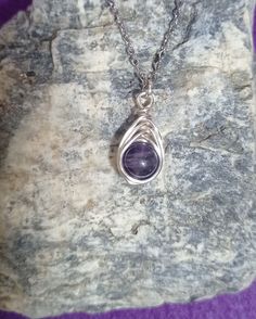 Immerse yourself in the enchanting beauty of the Handmade Silver Natural Amethyst Crystal Herringbone weave Pendant. Crafted with care and attention to detail, this pendant showcases a beautiful herringbone weave pattern carefully crafted from fine metal wire, such as sterling silver or silver plated copper.  The chain depicted in the image is measuring 45mm and it is made of stainless steel for the time being. Purple Hand Wrapped Spiritual Jewelry, Elegant Amethyst Necklace Hand Wrapped, Artisan Purple Hand Wrapped Jewelry, Artisan Hand Wrapped Purple Jewelry, Purple Artisan Hand-wrapped Jewelry, Elegant Hand Wrapped Amethyst Necklace, Handmade Lavender Crystal Necklaces Gift, Lavender Spiritual Pendant Jewelry, Handmade Lavender Crystal Necklace Gift