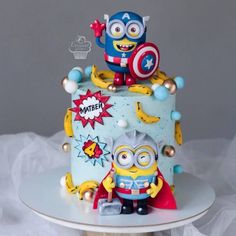 a three tiered cake decorated with characters from the movie despicinte and captain america