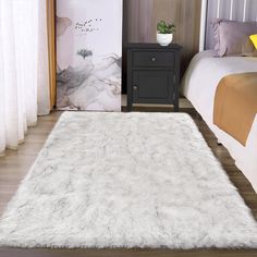 a white rug on the floor in a bedroom