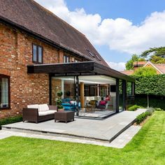 A contemporary black timber clad extension to a barn conversion. Wooden Conservatory Extension, Convert Conservatory To Extension, Corner Glazing Extension, Two Storey Glass Extension, Glass Apex Extension, Conservatory Extension, Creative Architecture, Room Extensions, Extension Designs