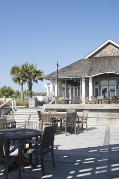 an outdoor dining area with tables and chairs