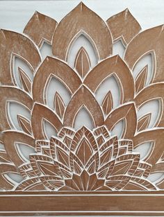 an intricately carved wooden panel with flowers