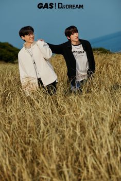 two young men standing next to each other in a field with the caption gas i dream