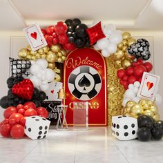 a casino themed backdrop with dices and balloons