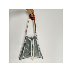 🌟 Elegant and modern, that's how our bucket bag can be described! 🌟 Made from clear vinyl in the front and transparent black in the back, this bag is the perfect combination of classic and contemporary. 👜 Fastened with clips on cotton ropes, giving it a maritime vibe, this bag is not only stylish but also functional. Measuring 12x12 inches (30x30 cm), it fits all your essentials, and the adjustable 43-inch (109 cm) strap allows you to wear it in multiple ways. 🎵 Ideal for concerts, games, an Modern Bucket Bag For Gifts, Modern Bucket Bag For Gift, Modern Bucket Shoulder Bag For Gift, Modern Bucket Bag As Gift, Modern Bucket Bag With Removable Pouch As Gift, Modern Bucket Bag Tote As Gift, Modern Bucket Tote Bag For Gifts, Modern Bucket Tote Bag As Gift, Clear Shoulder Bag With Clear Strap For Everyday