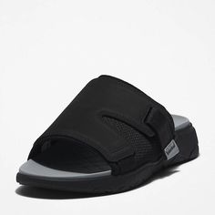 This men's slide sandal features a GreenStride™ comfort sole made using 75% renewable material, while the upper is crafted from coated Better Leather, which is sourced from a sustainable tannery rated silver for its environmental processes. Designed for comfort, this slide sandal also includes an EVA-blend foam midsole and footbed..GreenStride™ comfort sole made of 75% renewable materials, including sugar cane and responsible natural rubber Upper in coated Better Leather sourced from a sustainable tannery rated silver by the Leather Working Group for its water, energy, and waste management practices Durable ReBOTL™ fabric lining containing at least 50% recycled plastic Footbed and midsole in EVA-blend foam for cushioning Convenient slip-on style Rubber outsole for grip Leather Slides With Cushioned Footbed For Outdoor, Durable Synthetic Slides For Summer, Outdoor Synthetic Slides With Arch Support, Slip-resistant Open Toe Slides For Outdoor Activities, Durable Open Toe Synthetic Slides, Durable Synthetic Open Toe Slides, Slip-resistant Open Toe Slides For Outdoor, Outdoor Synthetic Slides With Textured Footbed, Durable Slide Sandals For Outdoors