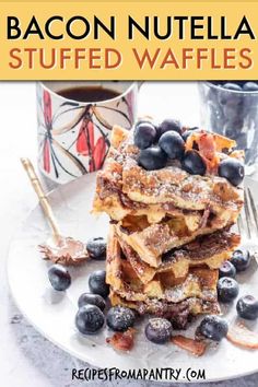 bacon nutella stuffed waffles stacked on top of each other with blueberries