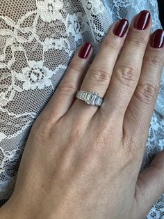 a woman's hand with a ring on it