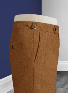 Tick off the suave yet sartorial characters while creating a unique investment to the closet with our Naples Gold Castle Tweed Highland Tweed Trousers. Crafted from pure wool material that portrays deep, warm and graciously smooth feelings, including a pleasant warmness with a solid pattern over a majestic rust shade. Approach a sharp, timeless style highlighting the persona to show off your curves with shapely tailoring that elevates the stunning stance at any stage. 
 
 Look Includes  Naples G Formal Tweed Bottoms With Herringbone Pattern, Brown Dress Pants With Belt Loops For Business, Elegant Fitted Tweed Bottoms, Formal Tailored Tweed Bottoms, Formal Tweed Tailored Bottoms, Tailored Tweed Bottoms For Formal Occasions, Brown Formal Bottoms For Winter, Elegant Tweed Pants For Business, Elegant Tweed Bottoms For Business