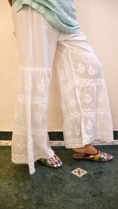 Pure Cotton Terrace Pants with 3 layers of exquisite chikankari embroidery.\ Drawstring. Elastic. Lace trims. Size - Free size  (Elastic unstretched fits waist 32 and stretched fits upto waist 48) Length - 39 inches Chikankari Embroidery, Chic Wardrobe, Womens Trousers, Embroidered Pants, Layer Design, Layer Dress, Pantalon Large, Three Layer, White Embroidery