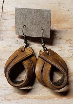 Leather earrings, loop, rustic, non-allergen hardware, cowgirl, classy. Brand new, never been worn. Approximately 1 inch by 1.5 inches. Vintage Hand-tooled Brown Jewelry, Vintage Brown Hand-tooled Jewelry, Unique Brown Jewelry For Everyday Use, Handmade Brown Jewelry For Everyday Use, Vintage Brown Drop Earrings, Brown Artisan Jewelry For Everyday, Artisan Brown Jewelry For Everyday Use, Rustic Drop Earrings With Ear Wire, Rustic Handmade Teardrop Earrings