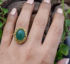 Vintage agate ring, a captivating design that lets you make a statement wherever you go. The green stone gives the ring a mesmerizing look. The design around the stones has yellower color to make the stone pop out even more. The design at the bottom of the ring is stunning, it really gives the ring the detail to set itself apart from other rings. A true piece of art. ■Design: Handcrafted agate ring ■Material: Solid 14k yellow gold ■Stamped: 585 Gold ■State: The ring is in excellent condition. ■R Vintage Style Open Emerald Ring For Gift, Vintage Green Opal Ring For Anniversary, Vintage Green Opal Round Ring, Vintage Green Oval Opal Ring, Vintage Green Opal Ring, Vintage Chrysoprase Ring Jewelry, Vintage Green Emerald Open Ring, Antique Handmade Green Emerald Ring, Handmade Vintage Emerald Ring For Anniversary