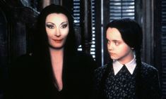 the addams are standing next to each other