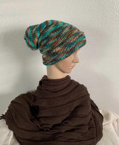 Super warm winter hat that can be worn extra slouchy with the brim pulled down. Made with an acrylic blended yarn. Size: OSFM Colors: Brown, Tan, Teal Hand Wash Cold, Air Dry Flat Warm One-size Beanie Bonnet, Warm Slouchy Bonnet For Cold Weather, Winter Acrylic Hat One Size, One Size Acrylic Winter Hat, Brimmed Beanie For Winter, One Size, Slouchy Beanie For Outdoor, Fall Beanie Bonnet In Acrylic, Outdoor Slouchy Beanie Hat, Winter Alpaca Crochet Hat, One Size