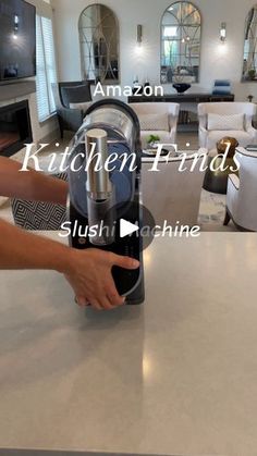 a person is using an appliance on a counter top in a living room