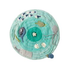 a round rug with various sea animals on it