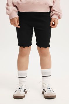 These Cute Little Biker Shorts Are Made From A Soft Stretch Cotton. They're Perfect For Sport, Gymnastics, Running And Play. The Elastic Waistband Makes Them Easy To Get On And Off, And We've Designed Them In A Range Of Colours To Suit Any Sports Uniform.Features:   -  Snug Fit   -  Mid Rise -  True Waistline -  Ultimate Comfort   -  Mid Thigh Length   -  Encased Elastic Full Width Of WaistbandComposition: Bci Cotton 95%, Elastane 5%Cotton On Kids - Hailey Bike Short - Black RibKids | Girls | Cl Casual Spring Leggings With Built-in Shorts, Casual Elastic Biker Shorts For Spring, Stretch Cotton Biker Shorts For Spring, Playful Black Cotton Shorts, Solid Cotton Biker Shorts With Elastic Waistband, Spring Elastic Biker Shorts, Elastic Biker Shorts For Spring, Spring Elastic Shorts For Playwear, Spring Playwear Shorts With Elastic Fit