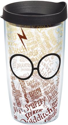 a harry potter travel mug with glasses and words all over the cup, on a white background