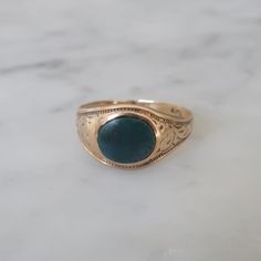 The cutest little bloodstone ring from circa 1930. Fabricated in a very Victorian style this ring is marked for 10kt gold which makes me think it is not Victorian butt rather vintage from the 1930's. Love the engraved detail on the sides and the extremely low profile of the ring. This ring has been very loved and worn over the years. Condition is good but well loved see pictures. Price refelects the worn nature of this adorable ring. currently this ring is a size 5.5. Bloodstone Ring, Ring Antique, Pinky Ring, Victorian Style, Ring Vintage, Victorian Fashion, Rings Statement, Low Profile, Vintage Rings