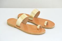 A minimal design that never goes out of style, these sandals are both fun/comfortable/versatile and fashionable. * Finest Quality Leather Genuine leather that comes from the island of Crete and it is famous for it's superior quality and uniqueness is picked one by one for our leather sandals. Ancient greek sandals were inspired and first created there. * Flexible Vibram Soles The soles used for our sandals are handmade completely in our family workshop ! They way we produce them is officially pa Modern Toe Loop Sandals For Beach, Modern Adjustable Open Toe Flip Flops, Modern Toe Ring Sandals For Beach And Summer, Modern Toe Ring Sandals For Summer Beach, Modern Toe Loop Slingback Sandals For Summer, Modern Toe Loop Sandals For Summer, Modern Toe Ring Sandals For Summer, Modern Toe Ring Sandals With Single Strap For Summer, Modern Toe Ring Sandals For Beach