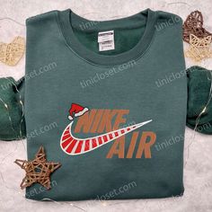 Introducing the Nike Air Christmas Logo Embroidered Shirt, a must-have for all sneaker enthusiasts and holiday lovers! This shirt showcases Christmas Crew Neck Sweatshirt With Embroidered Logo, Casual Christmas Crew Sweatshirt, Casual Christmas Crew Neck Sweatshirt, Casual Embroidered Christmas Top, Holiday Embroidered Casual Sweatshirt, Casual Embroidered Holiday Sweatshirt, Casual Holiday Embroidered Sweatshirt, Winter Gift Tops With Embroidered Logo, Casual Embroidered Sweatshirt For Holiday