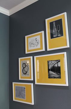 several framed photographs hang on the wall