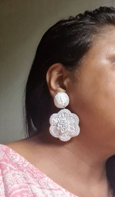 "Statement hand embroidered white raffia and seed beads wedding earrings. These super light in weight and beautiful earrings are ideal for bride or simply pair them in this summer season. The earrings measure approx. 2.20\" long and 1.85\" wide. We at Carnation jewellery make handmade & handcrafted jewellery. Since our product is purely handmade in nature hence a slight imperfection may be there but it is almost negligible. The colors and may slightly vary from the images shown but I try and mak Traditional Flower Earrings For Wedding, Traditional White Flower Earrings, Embroidered White Jewelry For Party, Traditional White Flower Wedding Earrings, Traditional White Beaded Earrings For Parties, Handmade White Earrings For Wedding, Traditional White Flower Earrings For Wedding, White Embroidered Jewelry For Party, Beaded Flower Earrings For Wedding