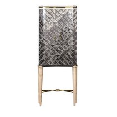 a black and white cabinet with gold legs