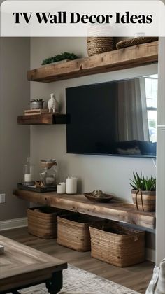 the tv is mounted above some shelves with baskets on them, and there are other items in front of it