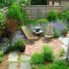 an outdoor patio with chairs and plants around it