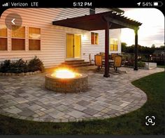 a fire pit sitting on top of a stone patio