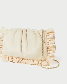 Clutch in vanilla moiré with ruffle detailing. Features a removable twisted gold chain strap, frame closure, and interior card slot. Spring Beige Clutch For Formal Occasions, Spring Formal Beige Clutch, Elegant Beige Evening Bag For Spring, Chic Cream Evening Bag, Chic Cream Evening Bag For Events, Gold Feminine Clutch For Formal Occasions, Feminine Beige Evening Bag For Formal Occasions, Elegant Formal Clutch For Spring, Chic Evening Bag With Chain For Events