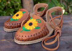 Womens brown sunflower embroidered leather closed toe lace up flat mexican sandals Brown Huaraches For Spring Vacation, Brown Huaraches For Vacation In Spring, Spring Vacation Brown Huaraches, Brown Flat Huaraches For Summer, Bohemian Spring Huaraches With Leather Sole, Brown Closed Toe Huaraches For Summer, Brown Closed Toe Summer Huaraches, Leather Sole Huarache Sandals For Spring Festival, Handmade Brown Huaraches For Spring